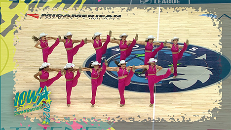 Eleven dancers in pink outfits and cowgirl hats dance at the 2024 Dance Team Championships.