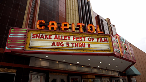 CAPITOL movie theater marquee that says, "Snake Alley Fest of Film ... Aug 5 Thru 8."