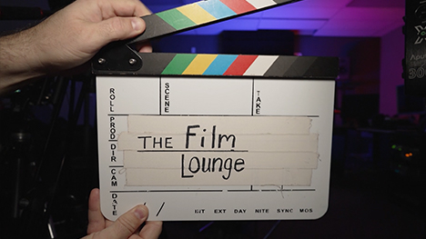 A film clapboard with The Film Lounge written on it.