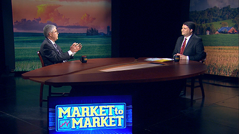 Arlan Suderman and Paul Yeager at the Market to Market desk.