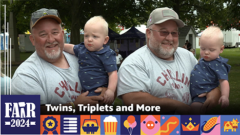 Twins, Triplets and More - A set of adult male twins hold a set of toddler boy twins.