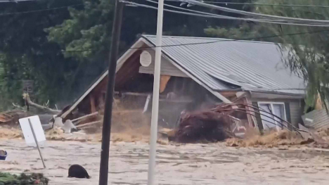 A building is destroyed by Hurricane Helene floodwaters.