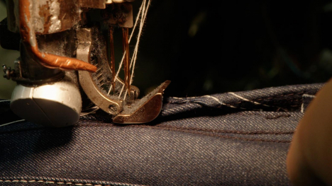 Close-up of sewing machine at Round House jeans factory in Oklahoma.