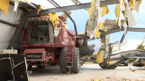 Combine in destroyed metal shed.