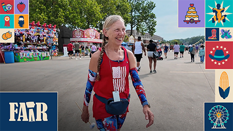Iowa State Fair enthusiast Ann Hegstrom walks the Grand Concourse in red, white and blue at the Iowa State Fair.