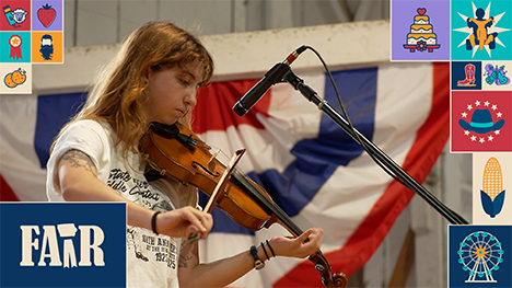 A fiddle player on stage at the Iowa State Fair.