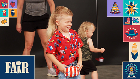 A small boy with a mullet competes in the Iowa State Fair mullet contest.
