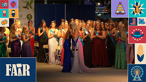 A stage of Iowa county queens celebrating the announcement of the new 2025 Iowa State Fair Queen as she embraces the outgoing 2024 Iowa State Fair Queen.