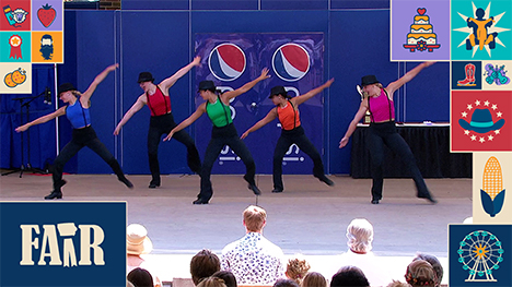 Five dancers in matching outfits perform on the Riley Stage at the Iowa State Fair