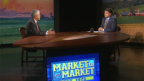 Arlan Suderman and Paul Yeager at the Market to Market desk.