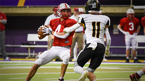 Football players in a football game.