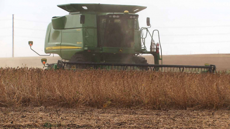 John Deere combine harvesting soybeans