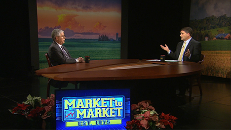 Arlan Suderman and Paul Yeager at the Market to Market desk.