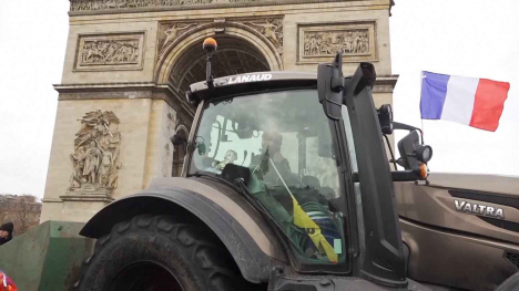 Tractor in front of Arc de Triomphe in Paris