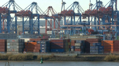 Shipping containers and cranes at the port in Hamburg, Germany