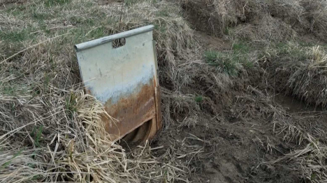 A dried up field drain - cracked open slightly.
