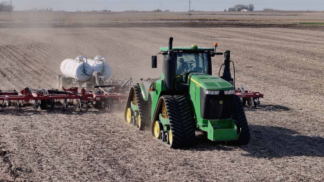 John Deere tractor knifes anhydrous ammonia into bean stubble