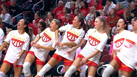 Some of the girls state basketball players dancing courtside.