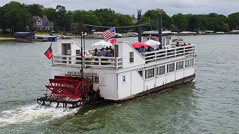 The Lady of the Lake, a paddlewheel boat, travels across Clear Lake.