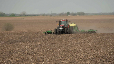 A tractor plants soybeans in Iowa.