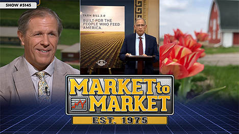 Market to Market - June 26, 2026 | Shawn Hackett, a man giving a presentation and a some flowers in front of a red barn on a farm.