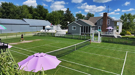 The All Iowa Lawn Tennis Club -- a grass tennis court in the backyard of a house.