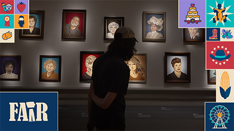 A patron of the arts takes in several portraits at the Smithsonian's Renwick Gallery in Washington, D.C.