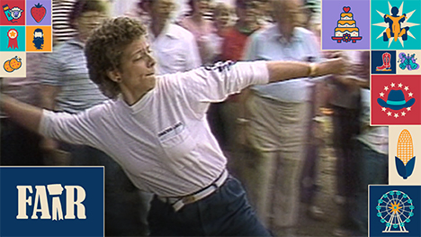 Pam Sufka-Boyd throws a cow chip at the Iowa State Fair in front of spectators.