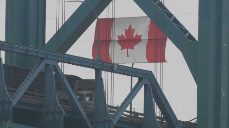 Canadian flag hanging inside an industrial steel facility.